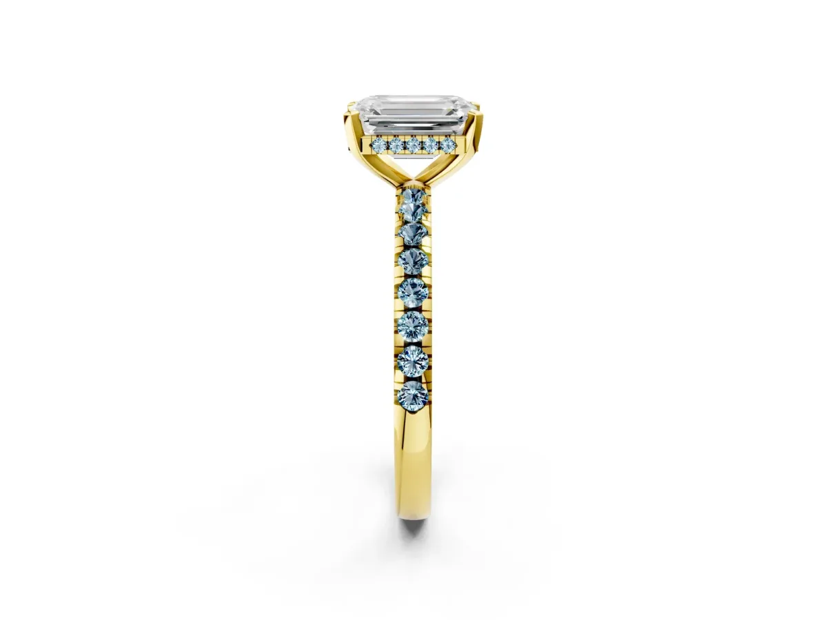 Emerald Cut Diamond Solitaire Ring with Round Aquamarine Pavé Band and Four-Prong Setting Yellow gold