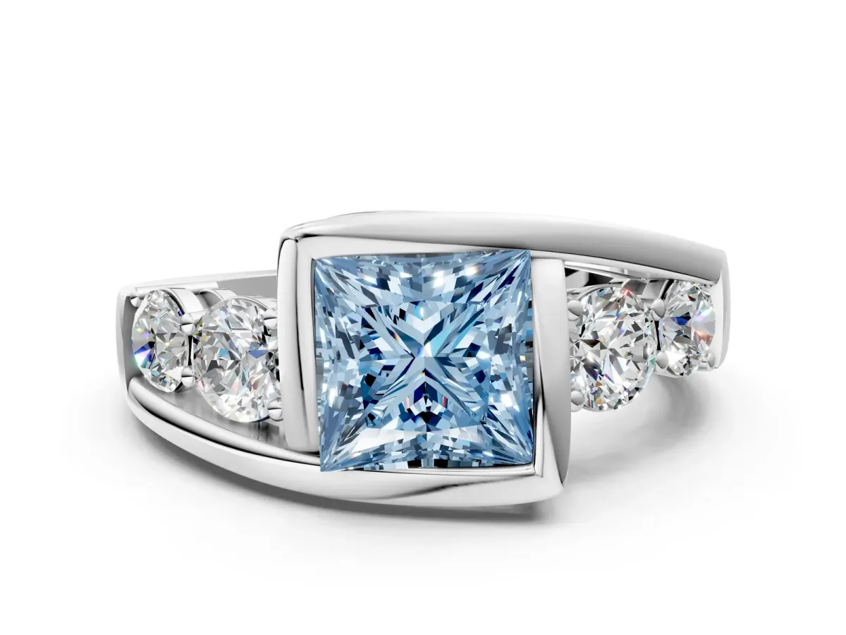Fancy Blue Bezel Set Princess Cut Diamond Bypass Ring with Round Accents Silver