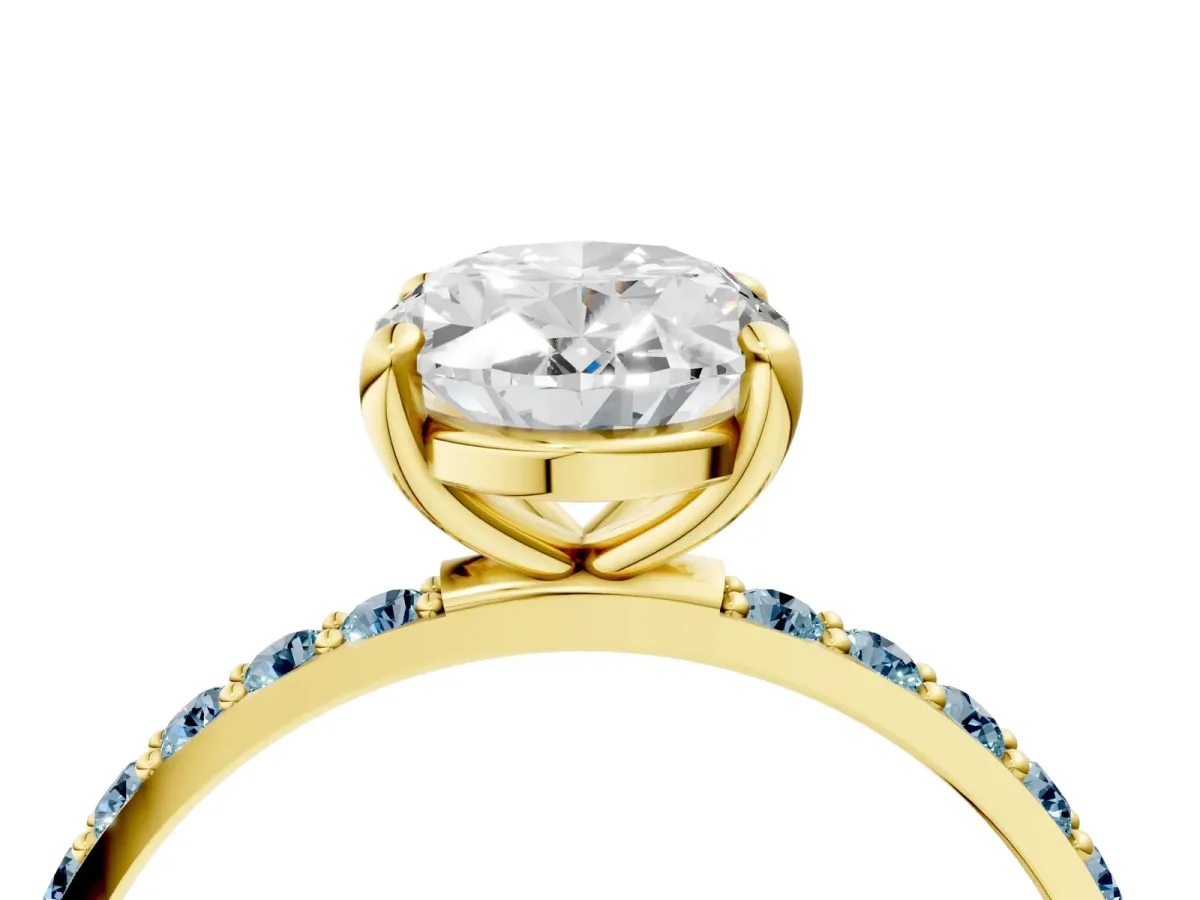 Oval Cut Diamond Solitaire Ring with Round Aquamarine Pavé Band and Prong Setting Yellow gold