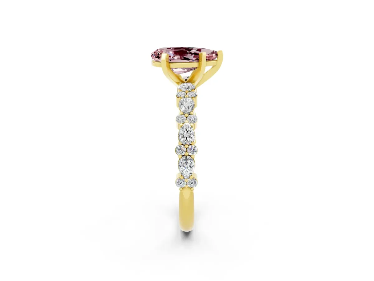 Pear Cut Morganite Side Stone Solitaire Ring with Round and Four-Prong Setting Yellow gold