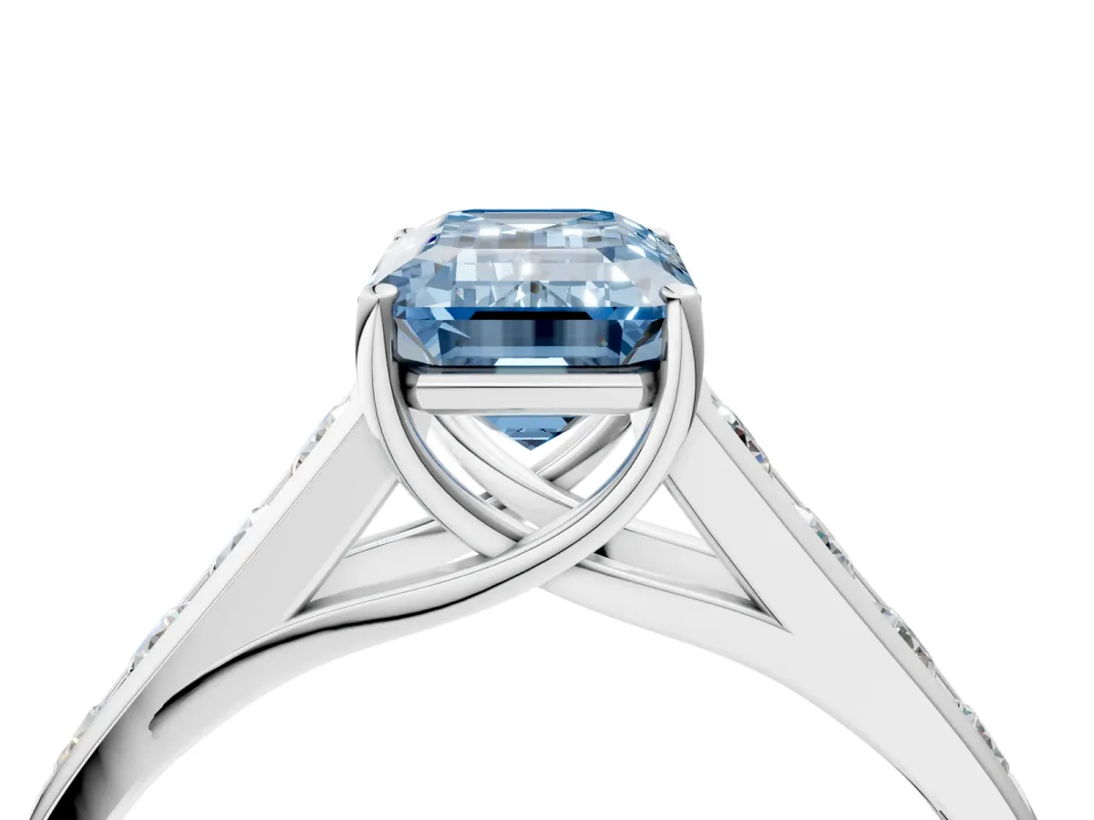 Fancy Blue Emerald Cut Brilliant Channel-Set Solitaire Ring with Four-Prong Setting White gold