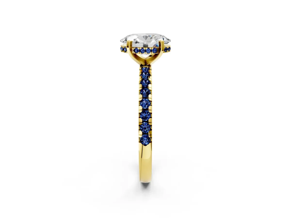 Oval Cut Diamond Solitaire Ring with Round Blue Sapphire Pavé Band and Four-Prong Setting Yellow gold