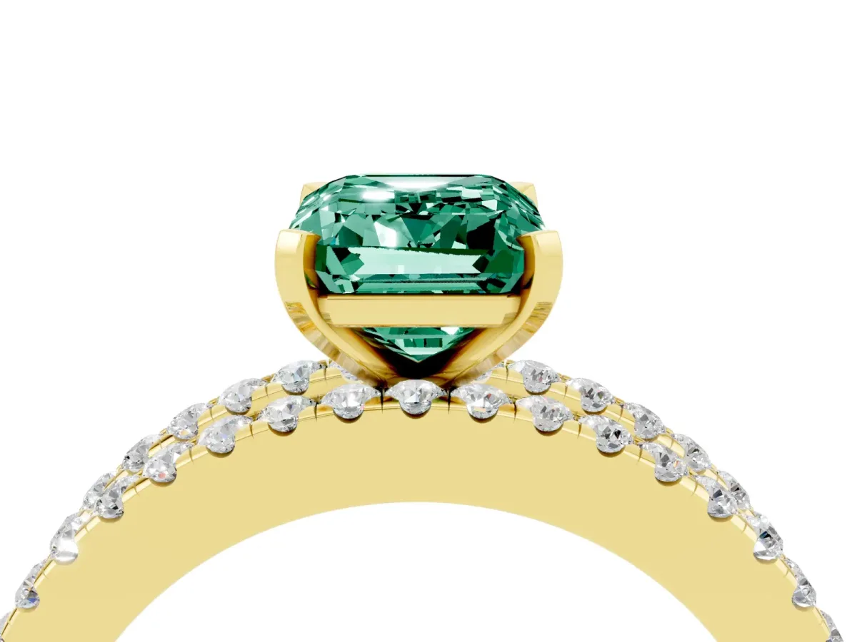 Emerald Cut Green Sapphire Solitaire Ring with Pavé and Channel Set Band Yellow gold