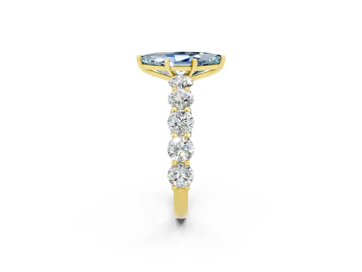 Marquise Cut Aquamarine Prong Setting with Side Stones on a Pave Band Yellow gold