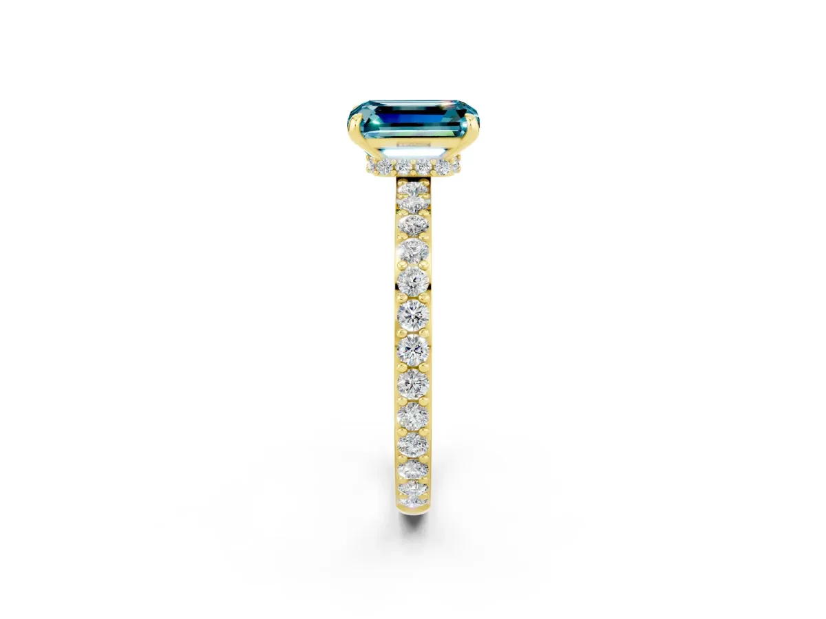 Emerald Cut Blue Topaz Solitaire Engagement Ring with Pavé Band and Four-Prong Setting Yellow gold