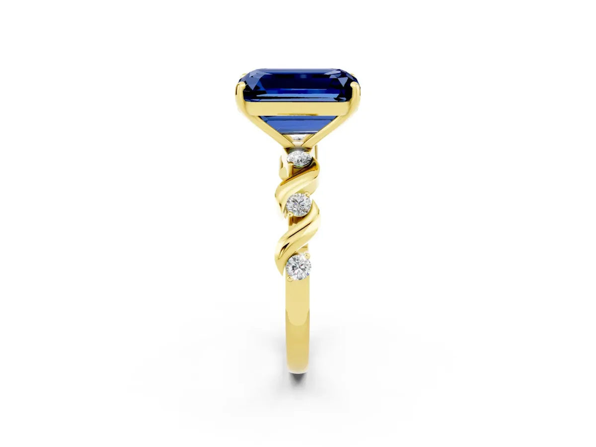 Emerald Cut Blue Sapphire Solitaire Twisted Band with Round Accents and Prong Setting Yellow gold