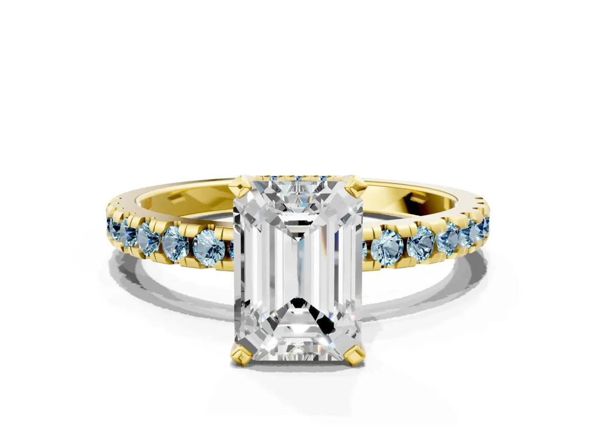 Emerald Cut Diamond Solitaire Ring with Round Aquamarine Pavé Band and Four-Prong Setting Yellow gold