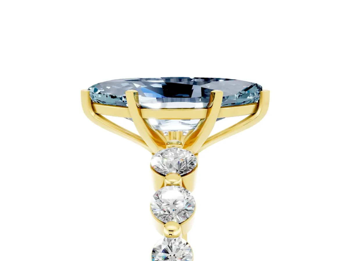 Marquise Cut Solitaire Aquamarine Ring with Pave Band and Four-Prong Setting Yellow gold