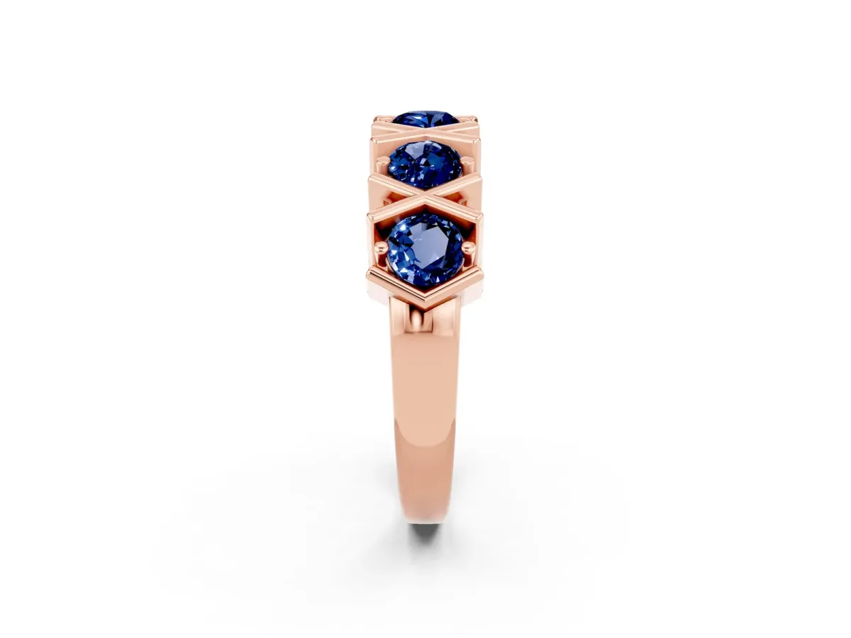 Round Blue Sapphire Channel Set Band with X-Prong Detail Rose gold