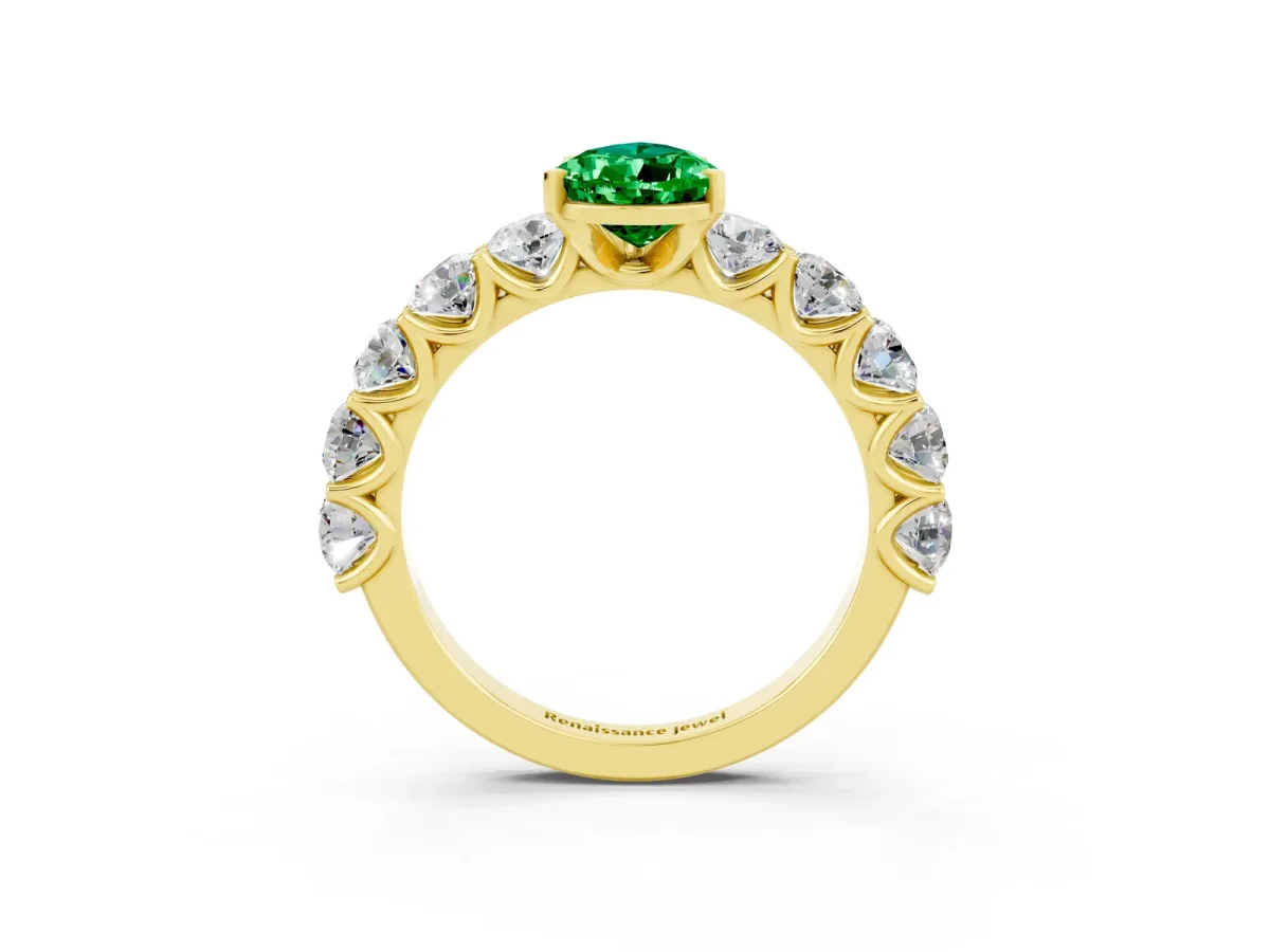 Pear Cut Emerald Prong Setting with Side Stones on a Pave Band Yellow gold