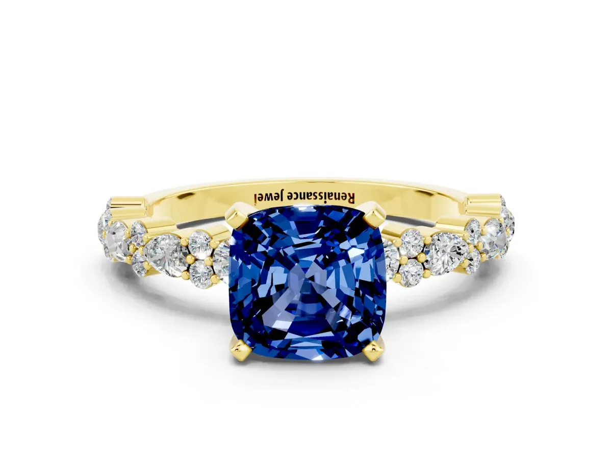 Cushion Cut Blue Sapphire Side Stone Solitaire Ring with Round and Four-Prong Setting Yellow gold