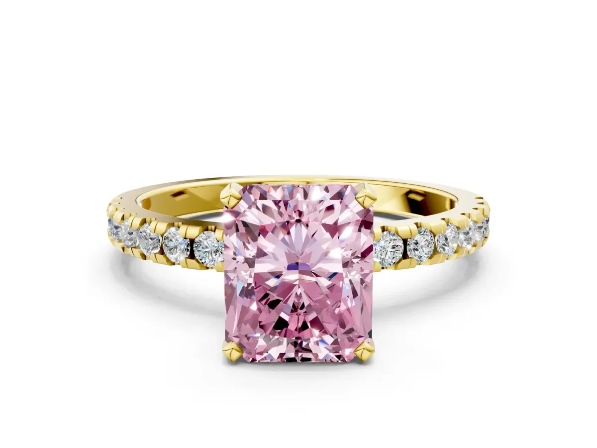 Fancy Pink Radiant Cut Diamond Solitaire Ring with Round Pavé Band and Four-Prong Setting Yellow gold