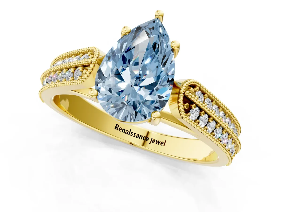 Fancy Blue Pear Cut Cut Pave Split Shank Engagement Ring with Four-Prong Setting Yellow gold