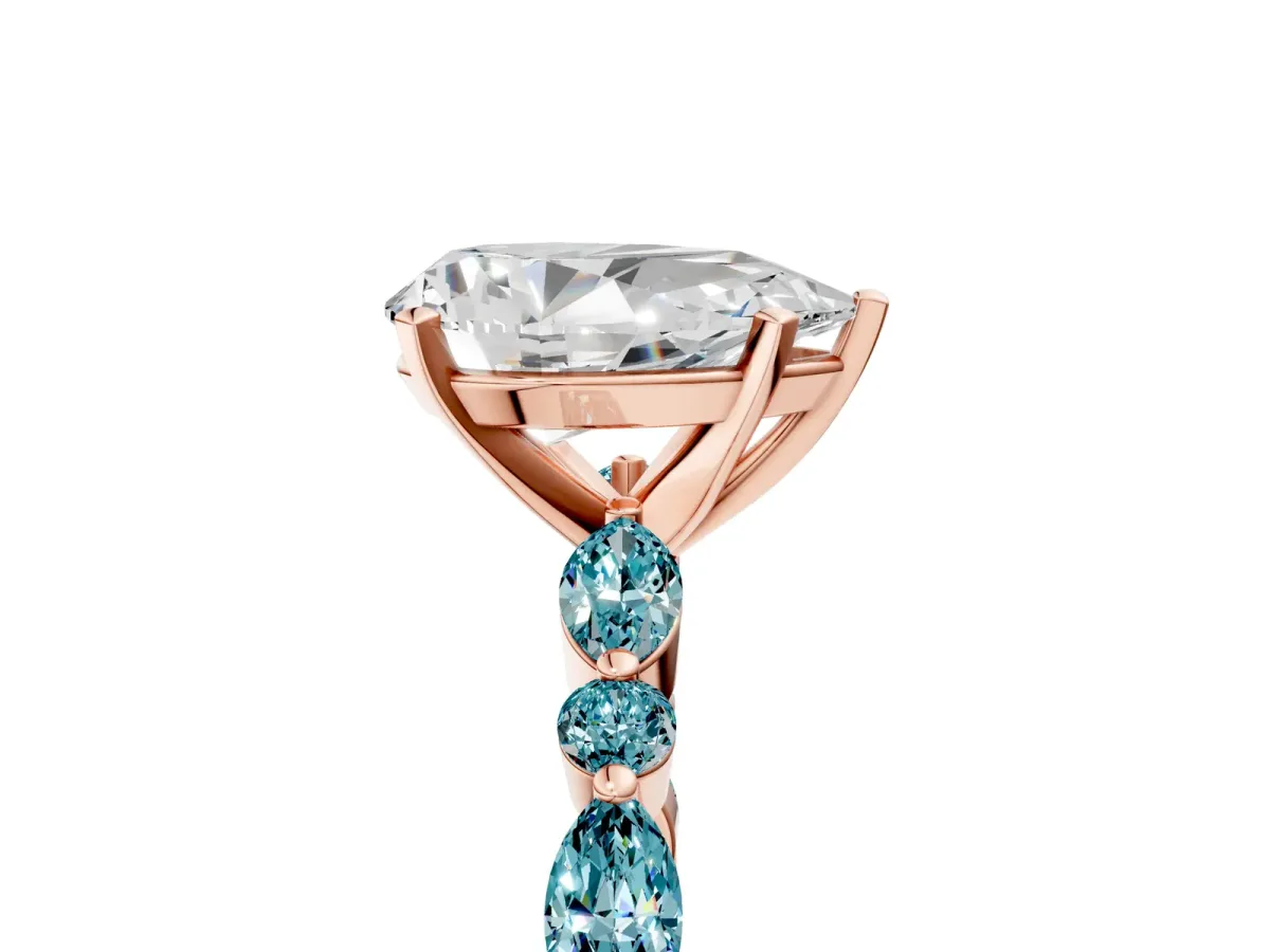 Pear Cut Diamond Ring with Marquise and Round Blue Topaz Side Stones and Four-Prong Setting Rose gold