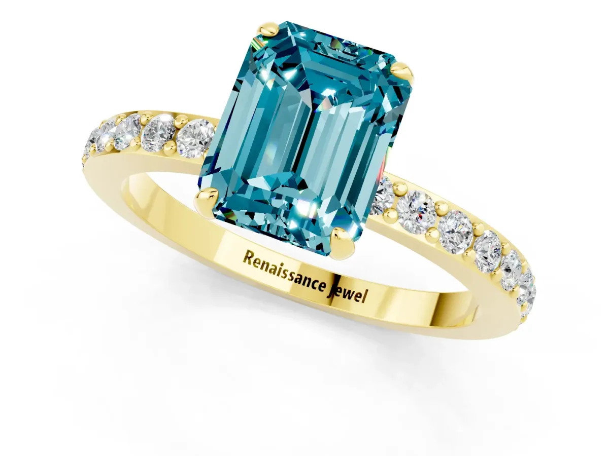 Emerald Cut Blue Topaz Solitaire Engagement Ring with Pavé Band and Four-Prong Setting Yellow gold
