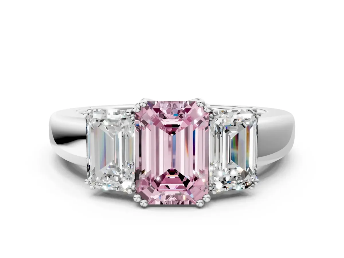 Fancy Pink Three-Stone Emerald Cut Cut Diamond Ring with Channel Set Band and Four-Prong Setting Platinum