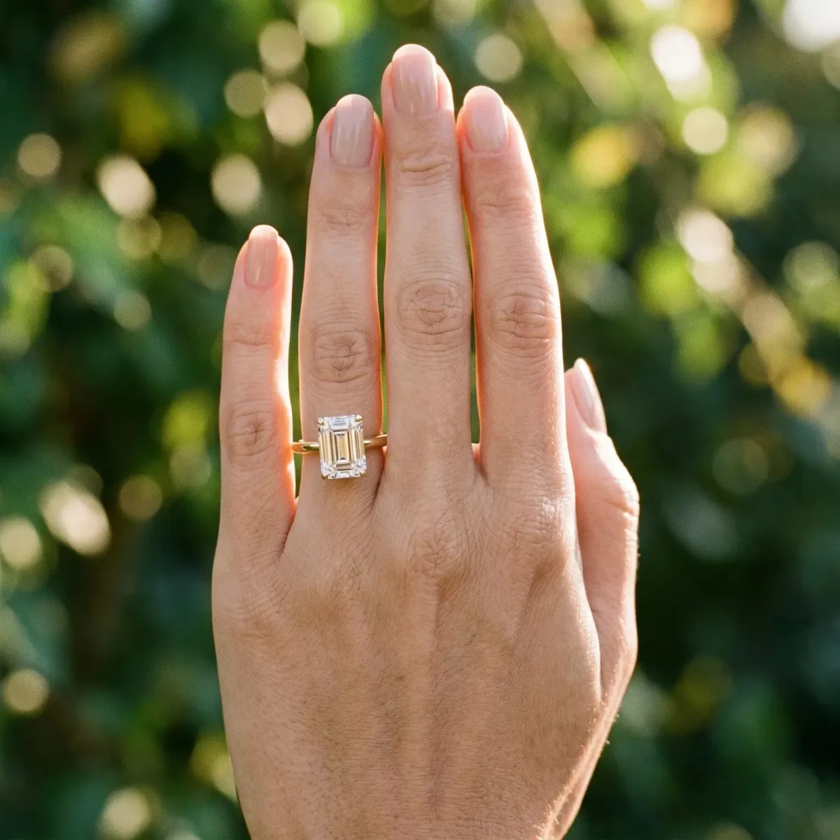 Emerald Cut Diamond Solitaire Ring with Six-Prong Setting and Classic Band Yellow gold