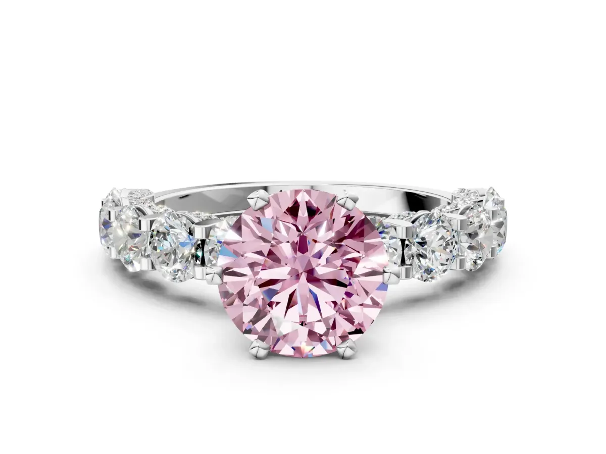 Fancy Pink Round Cut Diamond Side Stone Engagement Ring with Four-Prong Setting Silver