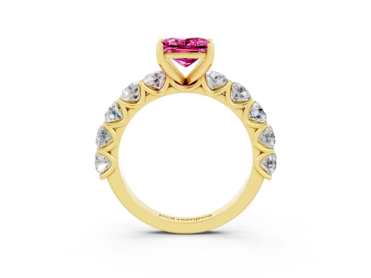Princess Cut Pink Sapphire Prong Setting with Side Stones on a Pave Band Yellow gold