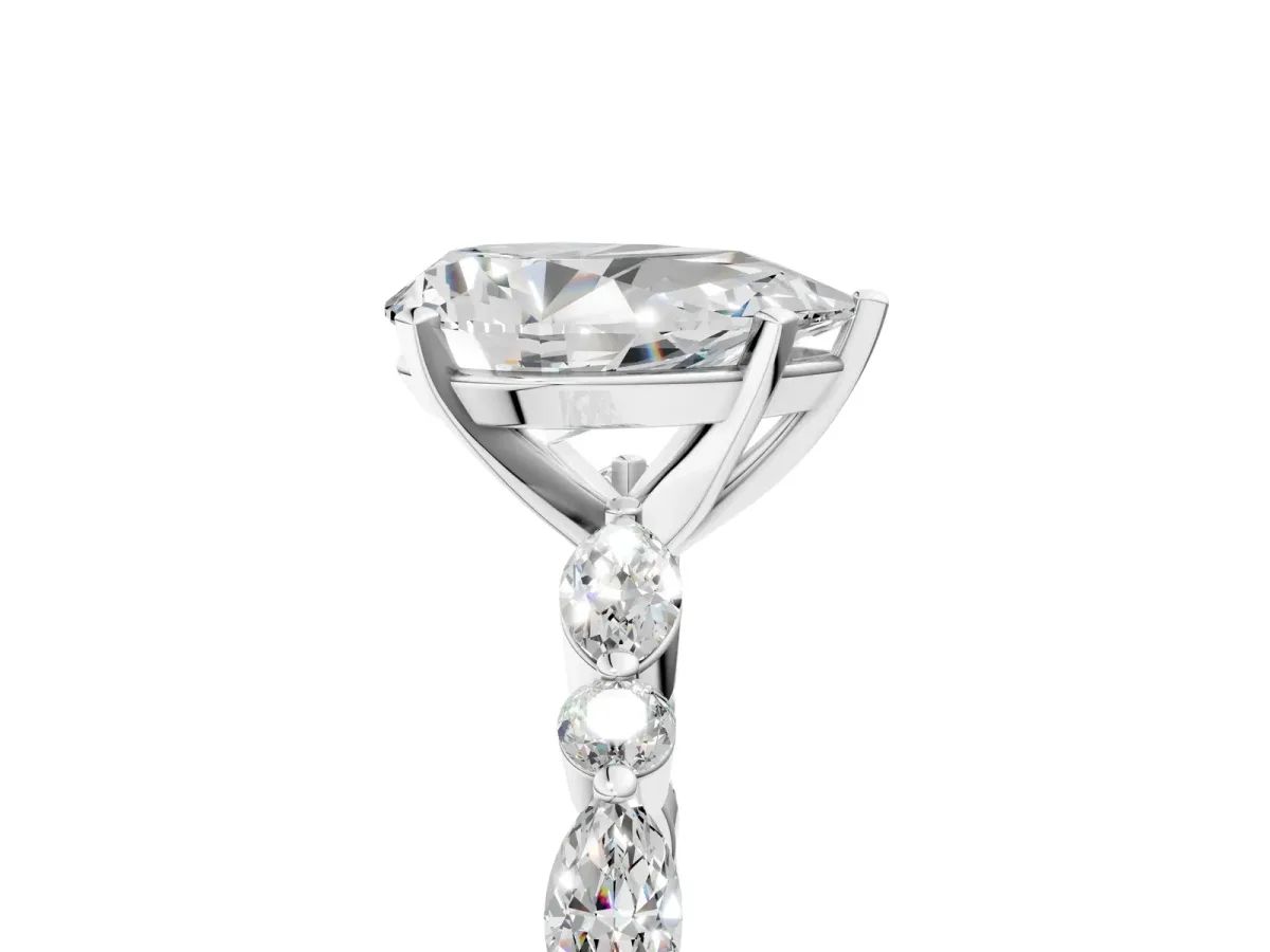 Pear Cut Diamond Ring with Marquise and Round Moissanite Side Stones and Four-Prong Setting White gold