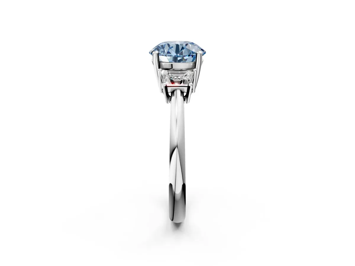 Fancy Blue Round Cut Diamond Three-Stone Ring with Trapezoid Side Stones and Prong Setting Platinum