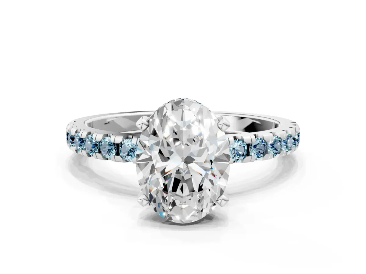 Oval Cut Diamond Solitaire Ring with Round Aquamarine Pavé Band and Four-Prong Setting White gold