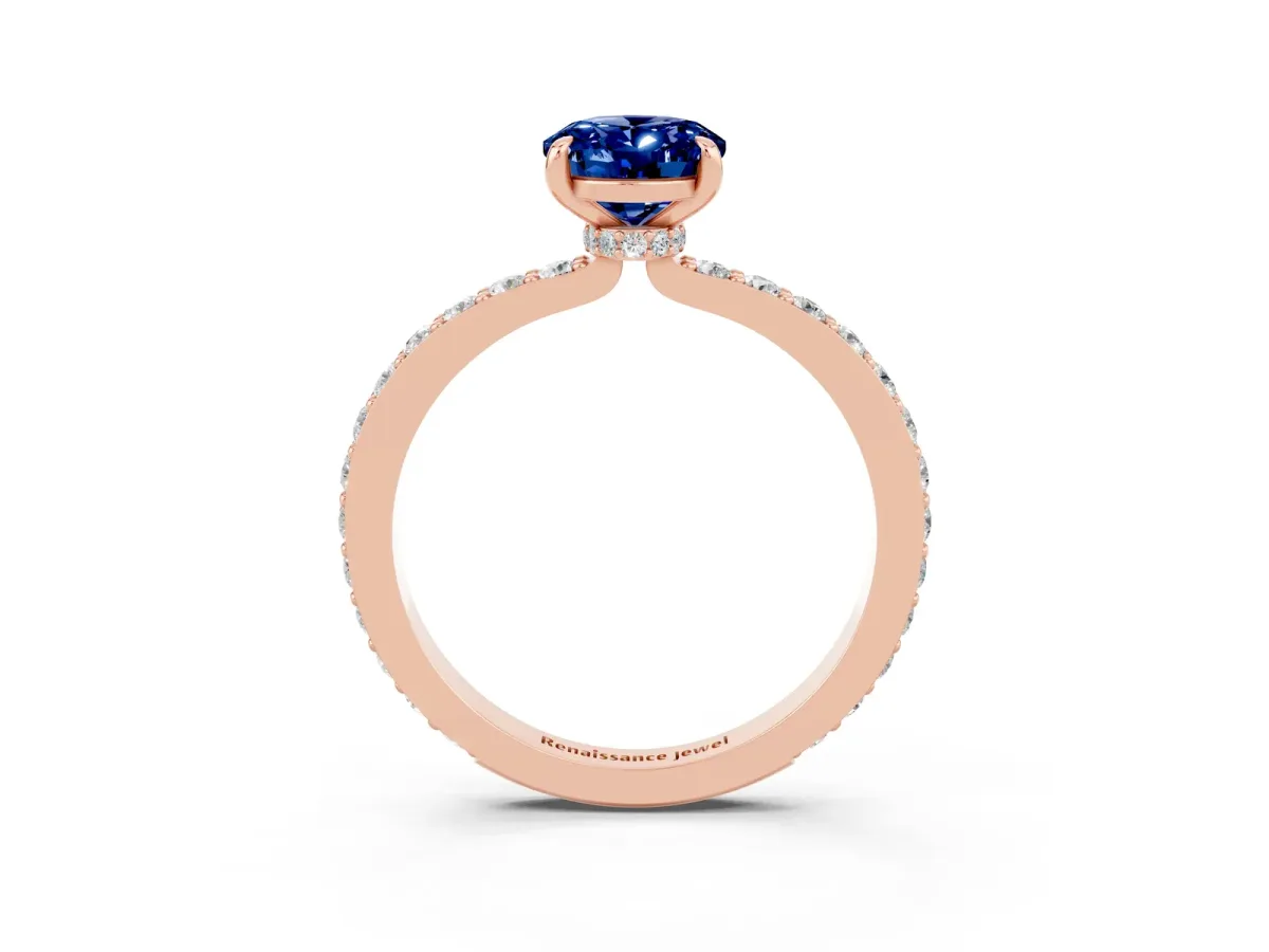 Oval Cut Blue Sapphire Solitaire Engagement Ring with Pavé Band and Four-Prong Setting Rose gold