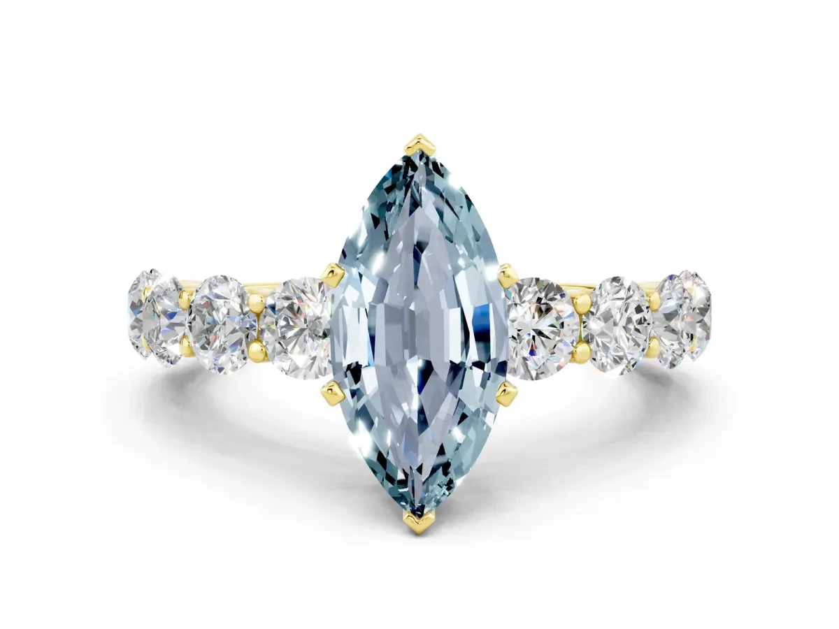 Marquise Cut Aquamarine Prong Setting with Side Stones on a Pave Band Yellow gold