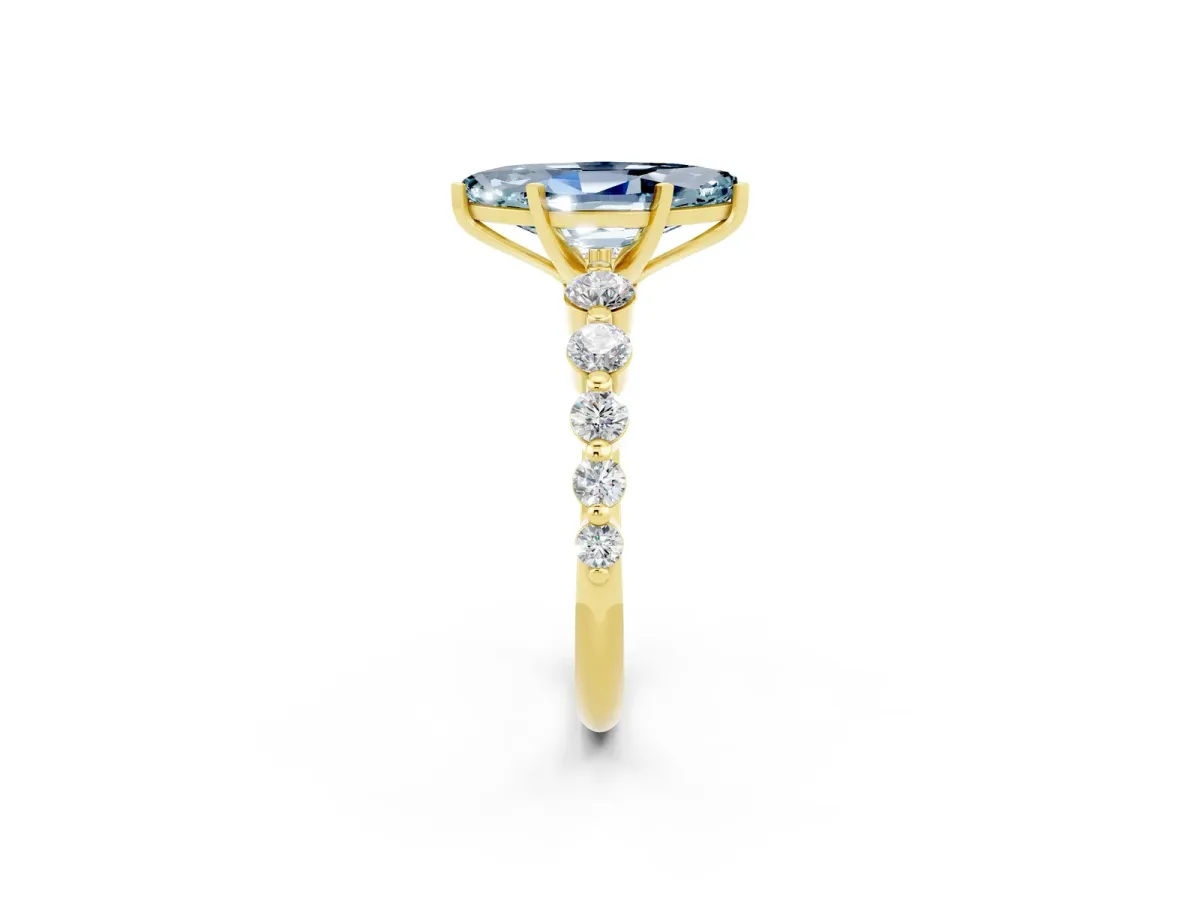 Marquise Cut Solitaire Aquamarine Ring with Pave Band and Four-Prong Setting Yellow gold
