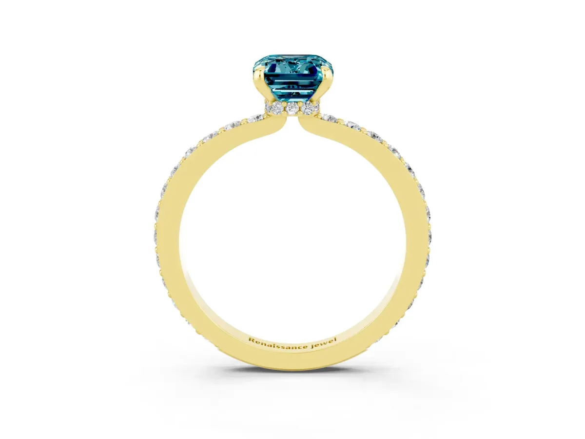 Emerald Cut Blue Topaz Solitaire Engagement Ring with Pavé Band and Four-Prong Setting Yellow gold