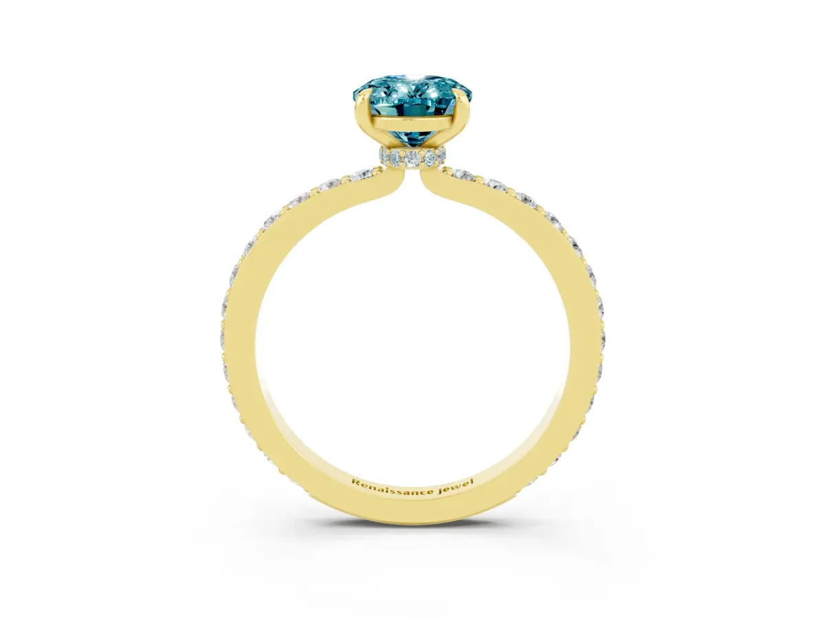 Oval Cut Blue Topaz Solitaire Engagement Ring with Pavé Band and Four-Prong Setting Yellow gold