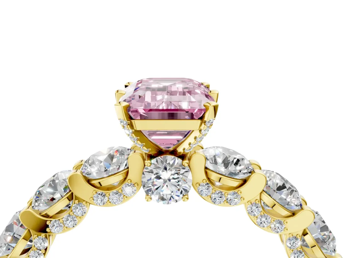 Fancy Pink Emerald Cut Diamond Side Stone Engagement Ring with Four-Prong Setting Yellow gold