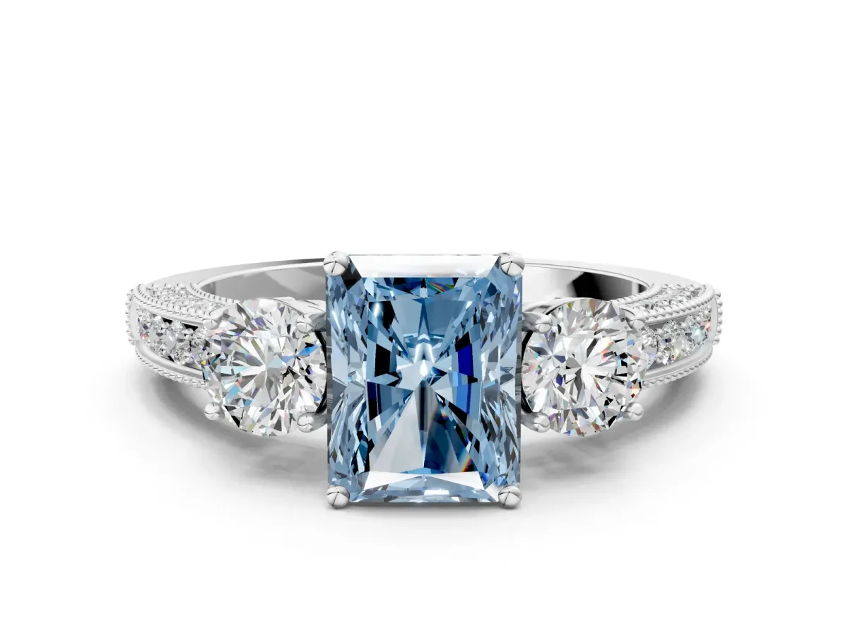 Fancy Blue Radiant Cut Three-Stone Diamond Ring with Pavé Band and Four-Prong Setting Platinum