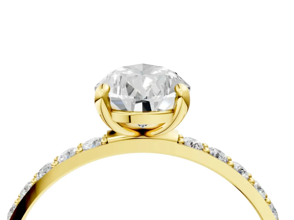 Pear Cut Diamond Solitaire Ring with Round Moissanite Pavé Band and Prong Setting Yellow gold