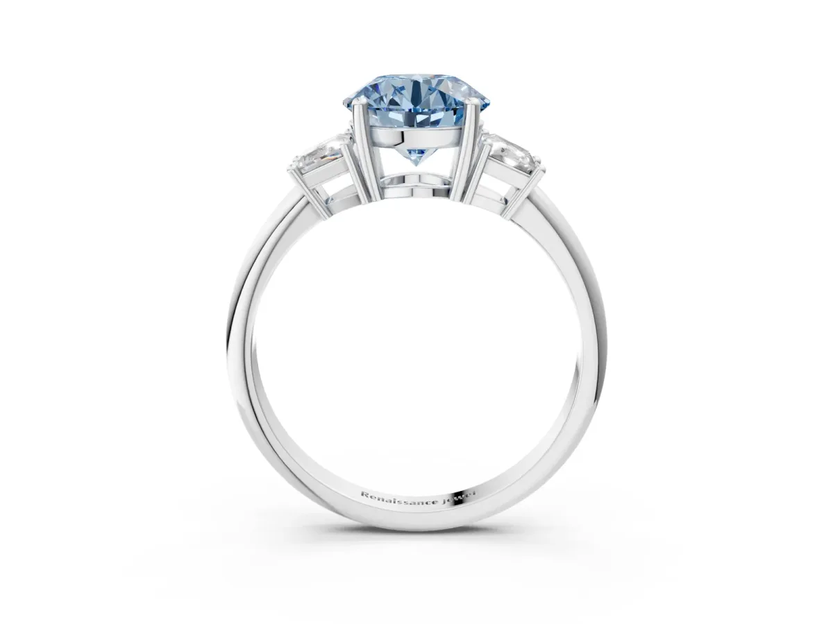 Fancy Blue Round Cut Diamond Three-Stone Ring with Trapezoid Side Stones and Prong Setting Platinum