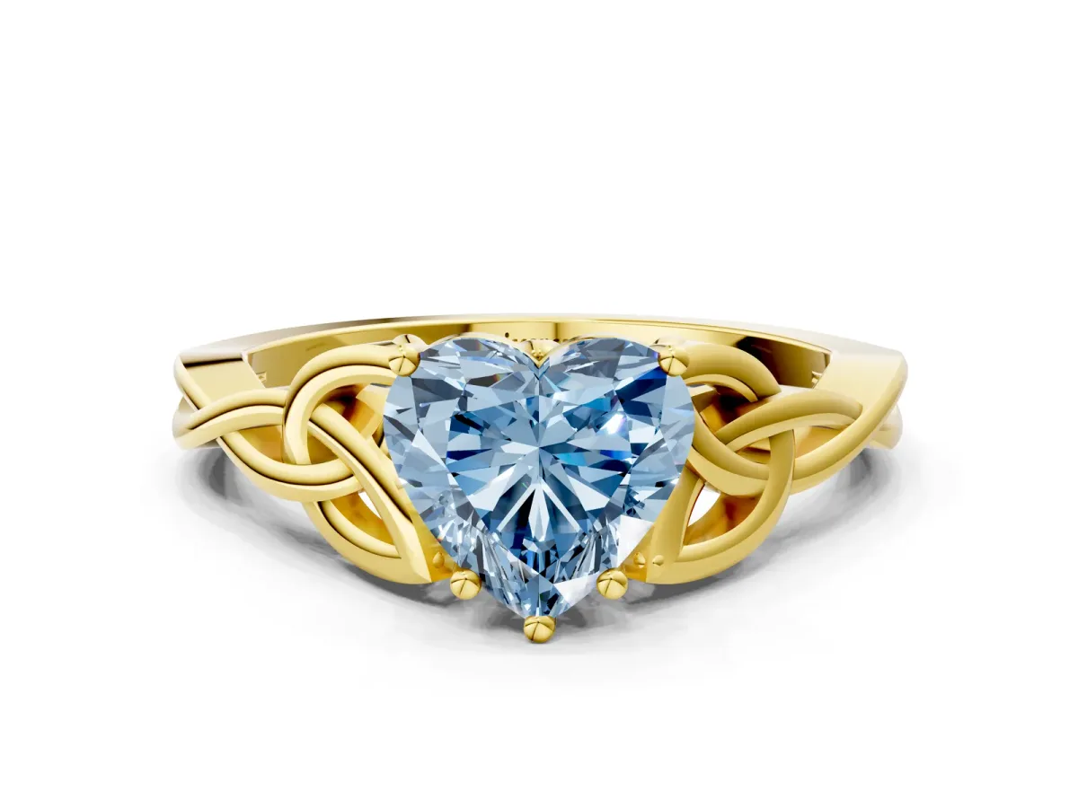 Fancy Blue Heart Cut Diamond Solitaire Engagement Ring with Celtic Knot Band and Four-Prong Setting Yellow gold