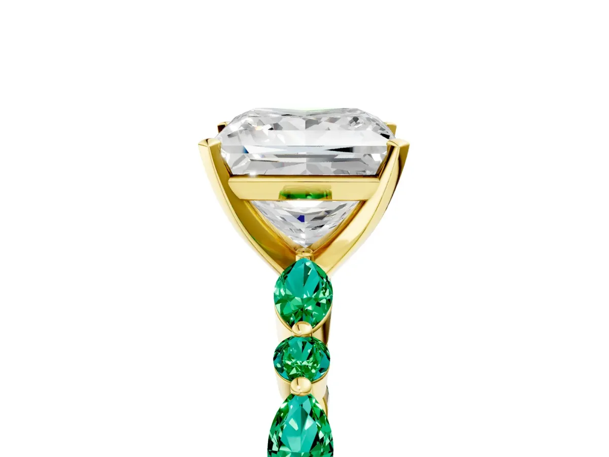 Princess Cut Diamond Ring with Marquise and Round Emerald Side Stones and Four-Prong Setting Yellow gold