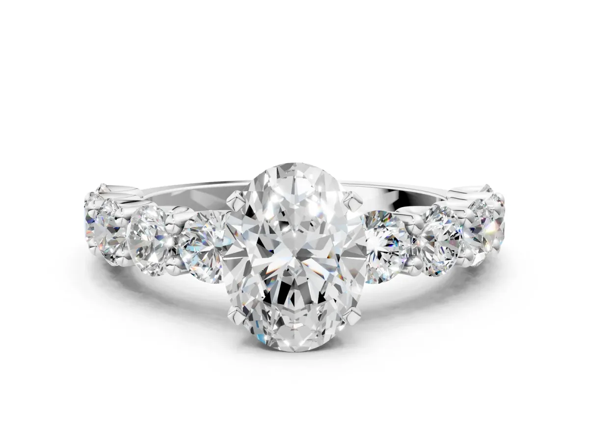 Oval Cut Diamond Prong Setting with Side Stones on a Pave Band Silver