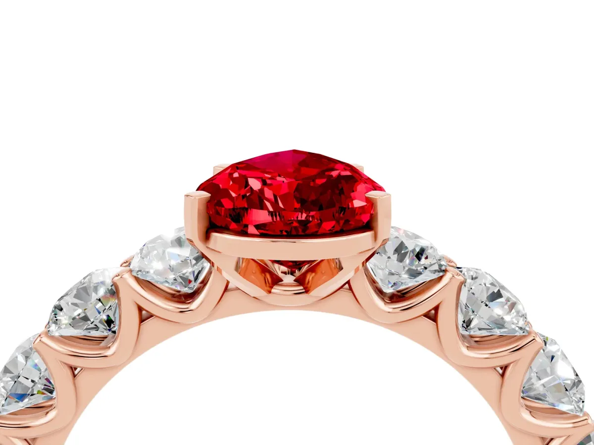 Pear Cut Ruby Prong Setting with Side Stones on a Pave Band Rose gold