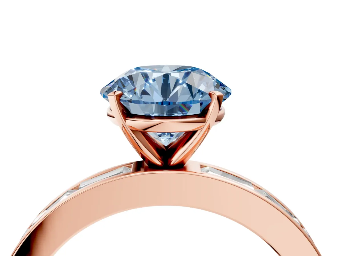 Fancy Blue Round Cut Solitaire Diamond Ring with Channel-Set Baguette Band and Four-Prong Setting Rose gold