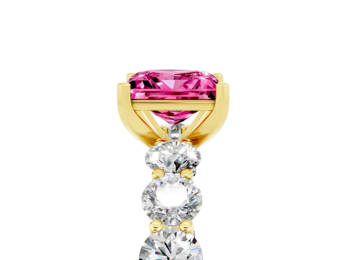 Princess Cut Pink Sapphire Prong Setting with Side Stones on a Pave Band Yellow gold