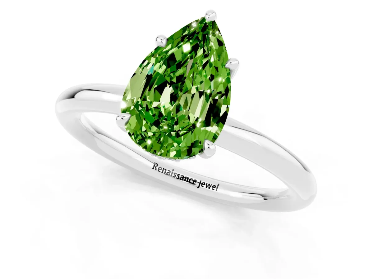 Pear Cut Peridot Solitaire Ring with Thin Band and Four-Prong Setting Silver
