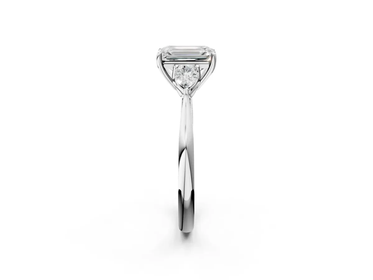 Three-Stone Emerald Cut Diamond Ring with Pear Side Stones in Four-Prong Setting White gold