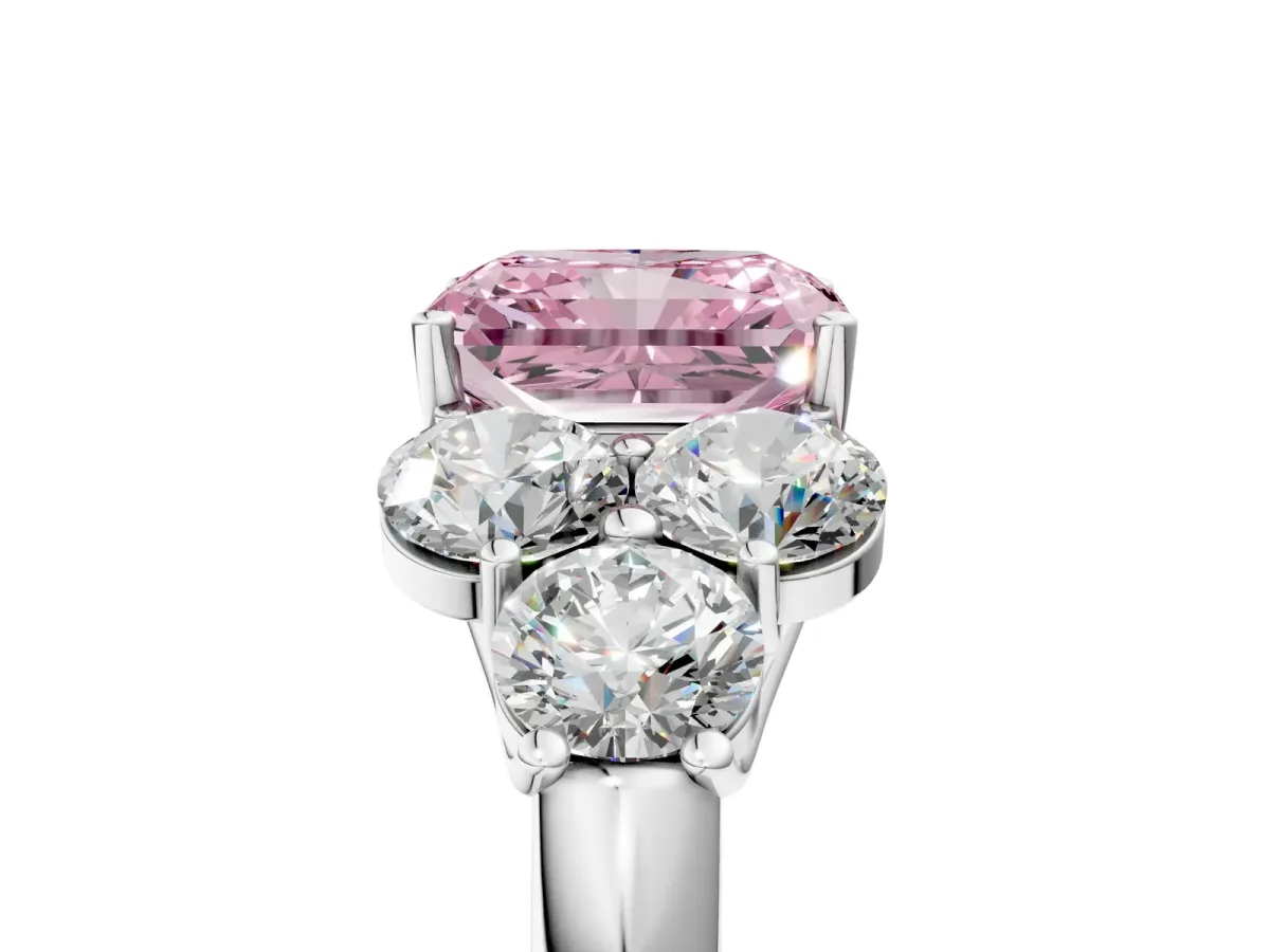 Fancy Pink Radiant Cut Cut Diamond Cluster Ring with Round Accent Stones and Prong Setting on a Classic Band Platinum