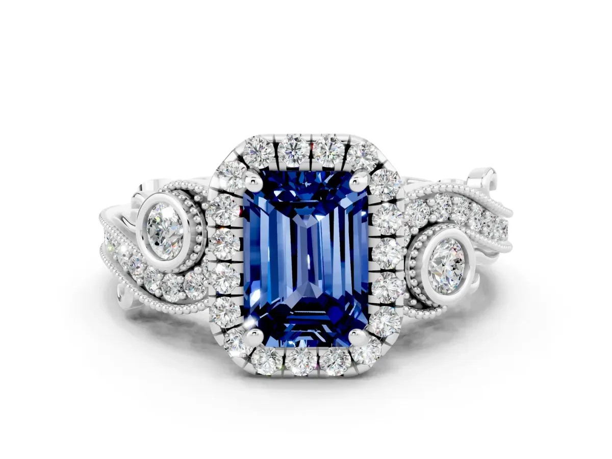 Emerald Cut Blue Sapphire Halo Ring with Milgrain Pavé Band and Four-Prong Setting White gold