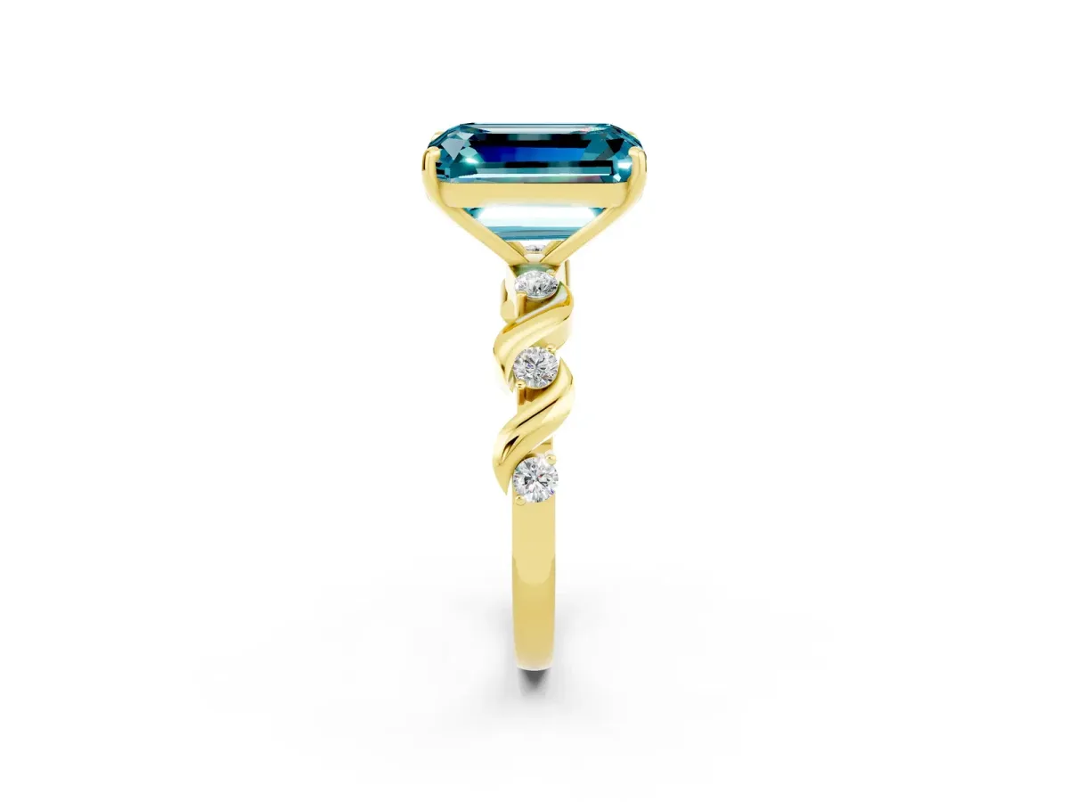 Emerald Cut Blue Topaz Solitaire Twisted Band with Round Accents and Prong Setting Yellow gold