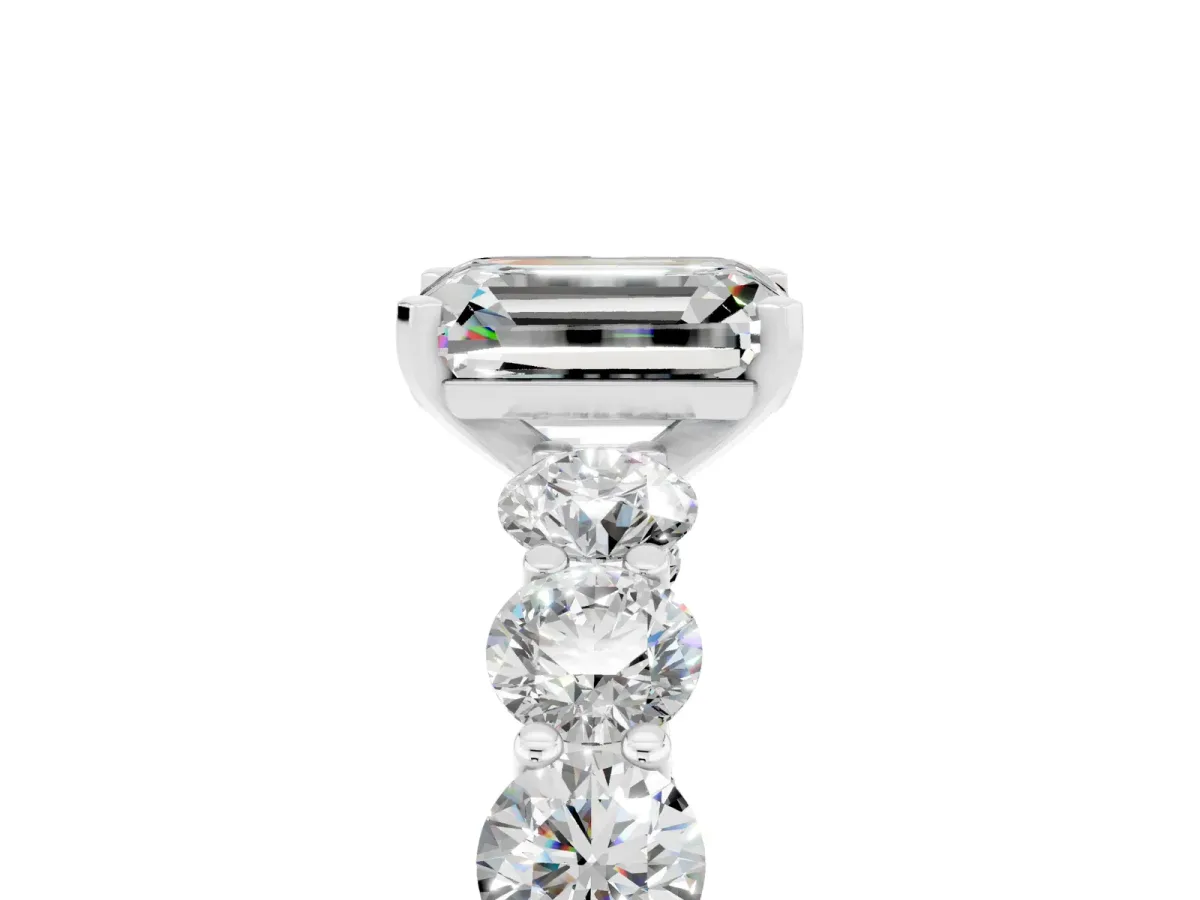 Emerald Cut Moissanite Prong Setting with Side Stones on a Pave Band Silver