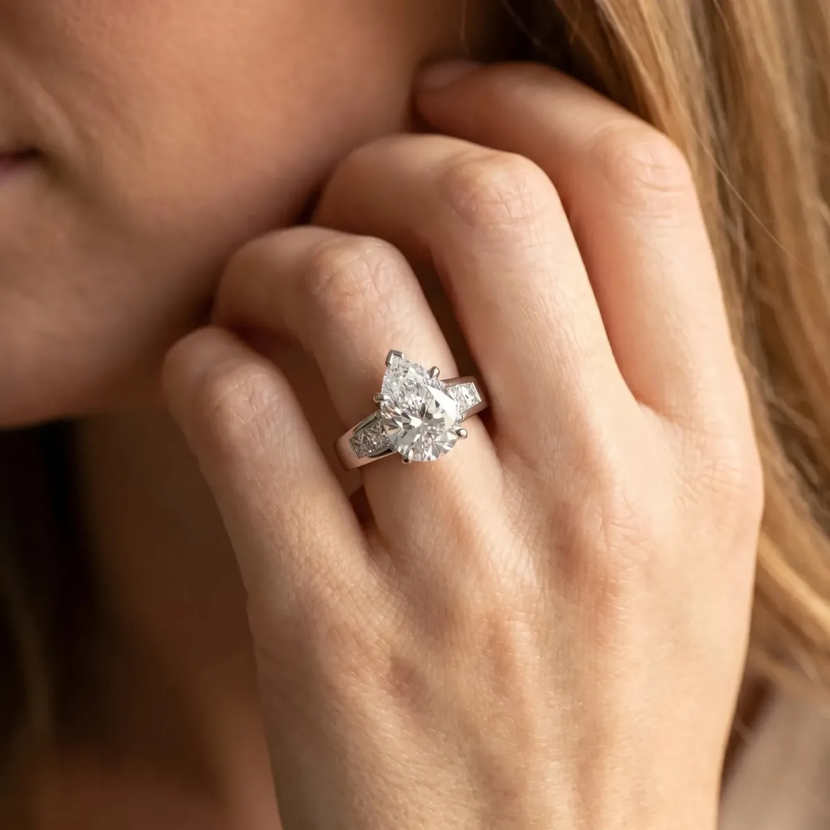Pear Cut Cut Channel Set Solitaire Ring with Four-Prong Setting White gold