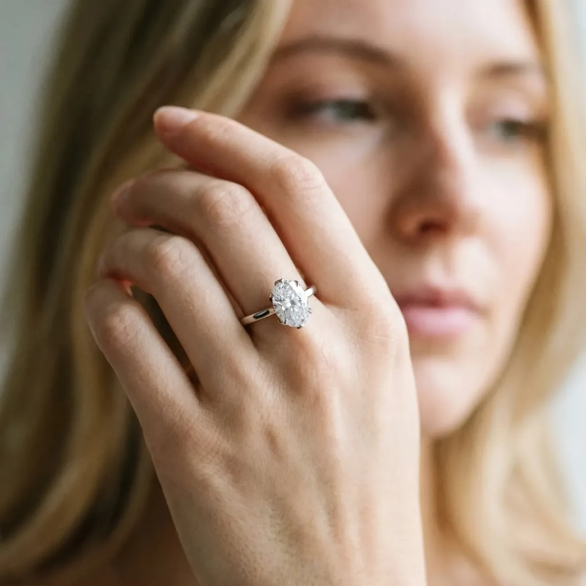 Oval Cut Diamond Solitaire Ring with Flower Prong Setting and Classic Band Silver