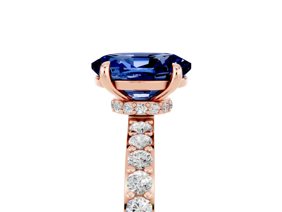 Oval Cut Blue Sapphire Solitaire Engagement Ring with Pavé Band and Four-Prong Setting Rose gold